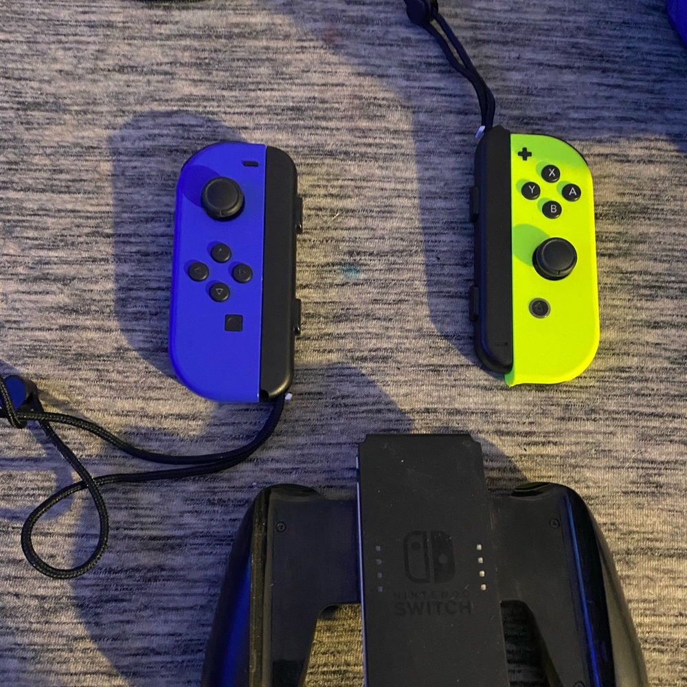 nintendo switch remotes (2) and controller